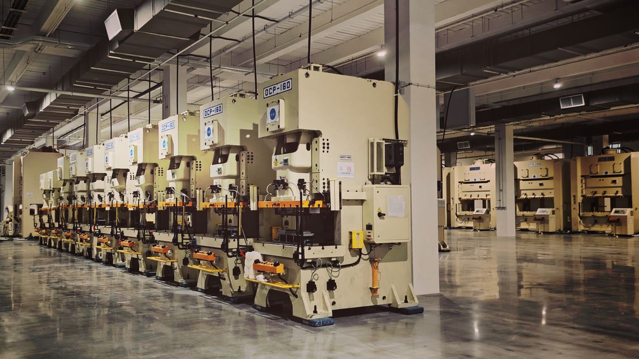 A row of production machines inside a large factory